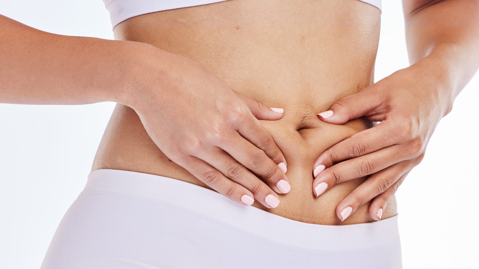Woman receiving gut massage on white background