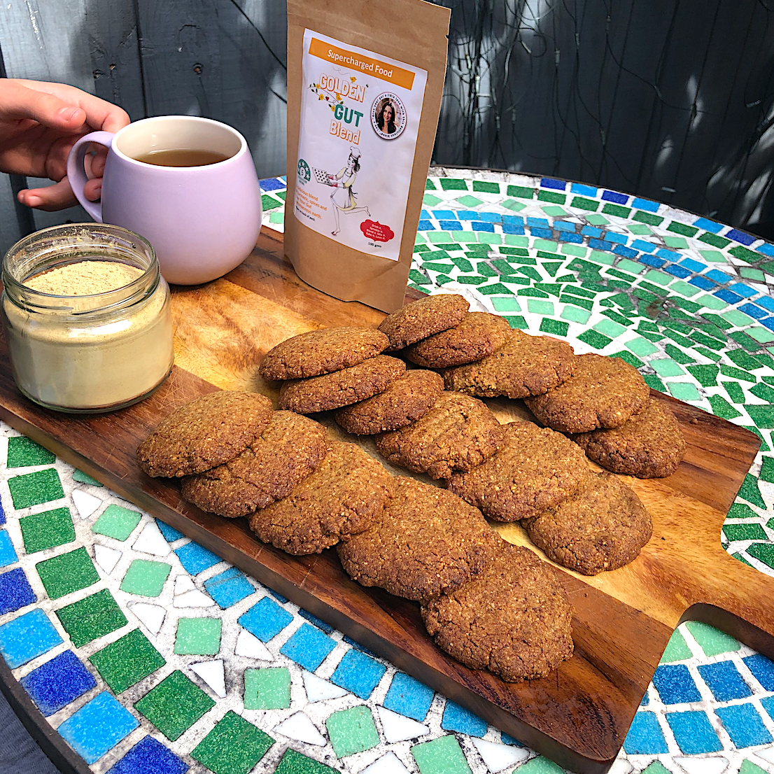 A table displaying a tray of cookies, featuring the Golden Gut Digestive Cookie.