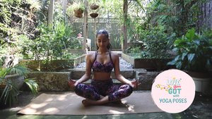 Woman practicing yoga in garden