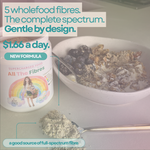 Bowl of porridge with a spoonful of All The Fibres: five fibres in every loving spoonful